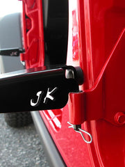 Load image into Gallery viewer, Rear driver's side foot peg mounted on the Jeep Wrangler JKU with JK cutout