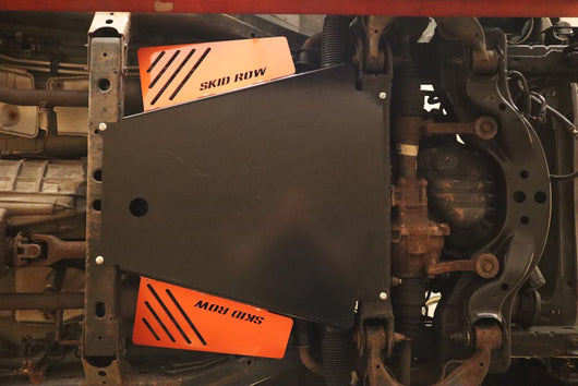 Toyota Tundra transmission skid plate installed with catalytic converter shields shown in orange to make them easier to see.