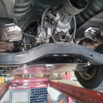 Load image into Gallery viewer, Installation on 2WD truck with curved transmission crossmember. 
