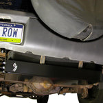 Load image into Gallery viewer, Close up view of the gas tank skid plate installed on a Jeep Liberty KJ
