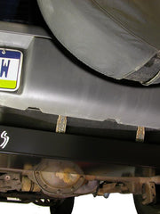 Load image into Gallery viewer, Close up view of the gas tank skid plate installed on a Jeep Liberty KJ
