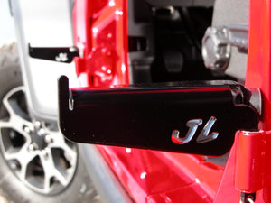 Foot pegs mounted on driver's side front and rear doors on Jeep Wrangler JL with JL logo