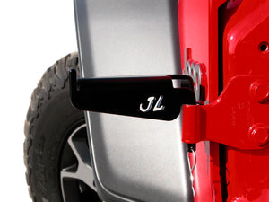 Driver's side front door foot peg mounted on Jeep Wrangler JL with logo